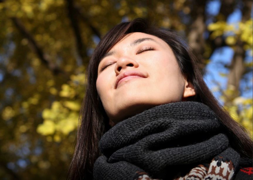 Woman enjoying warm sun