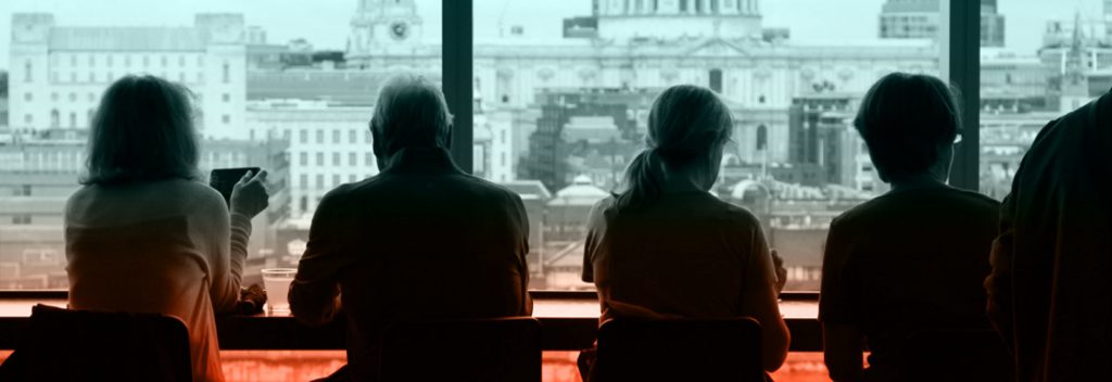 Four people sitting in a restaurant.