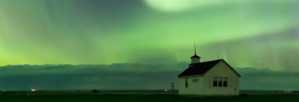 A church shown under Northern Lights