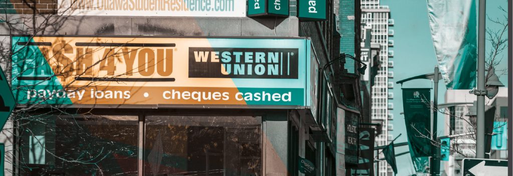 Two payday loan storefronts side-by-side.