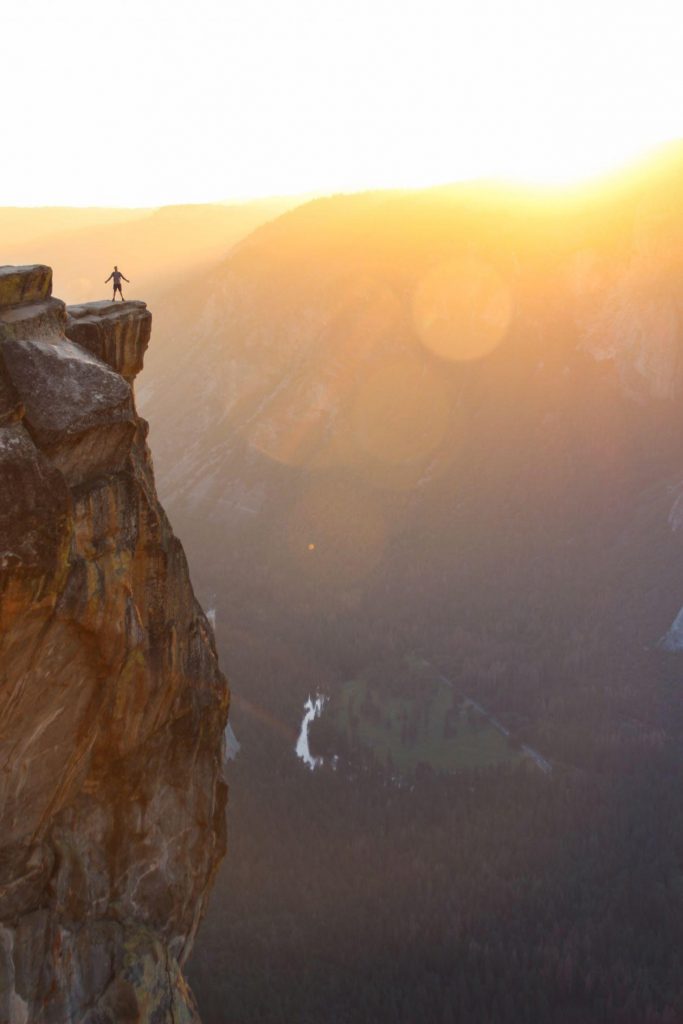 Man on cliffside, for some reason