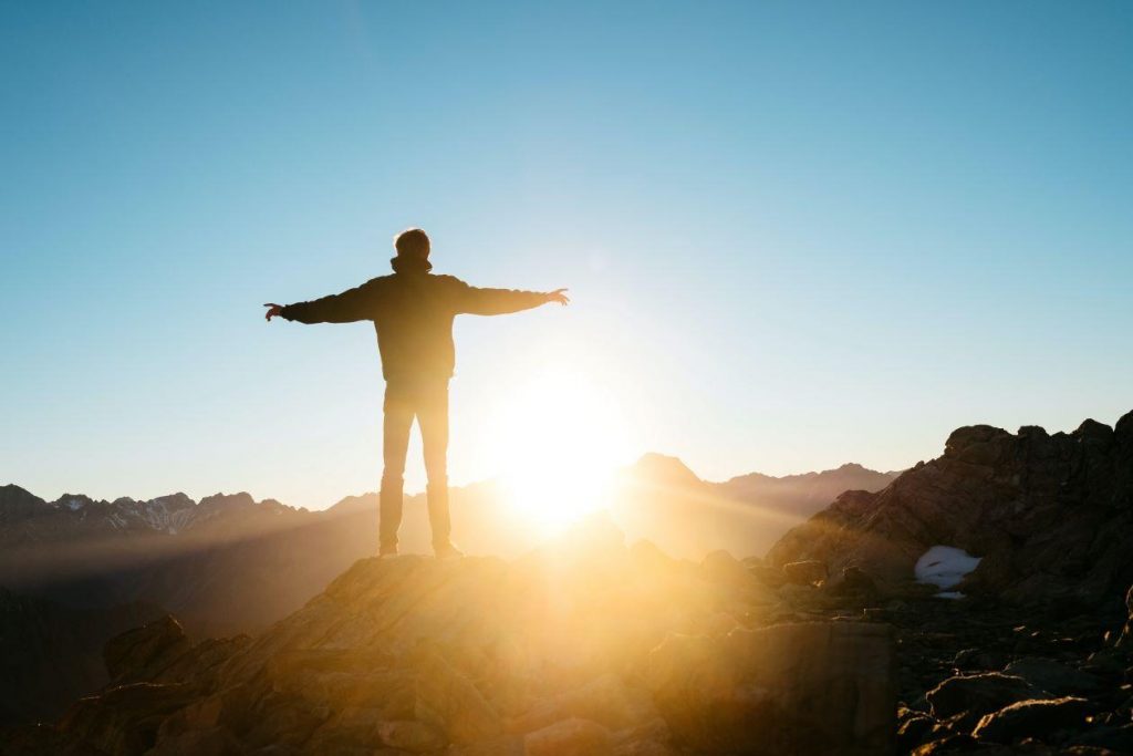 Man standing at sunrise