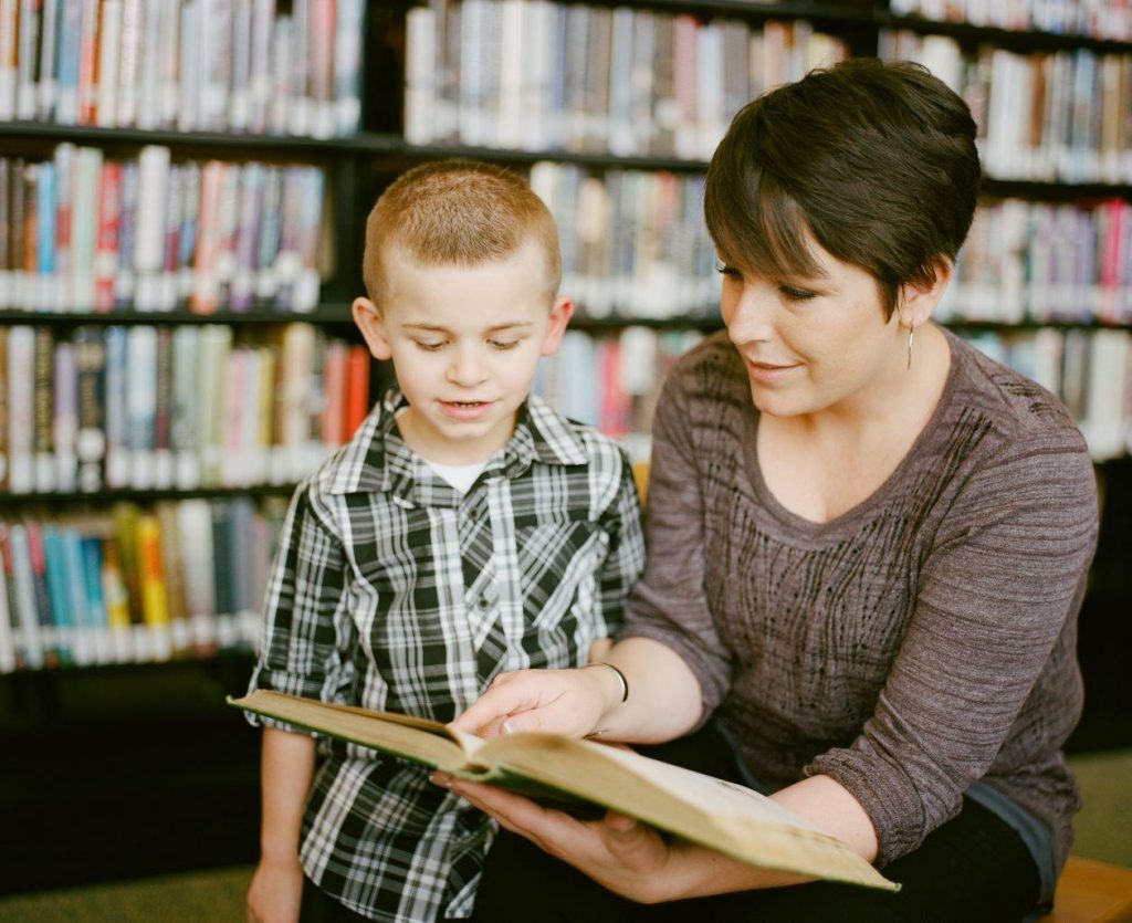 Woman reading to child