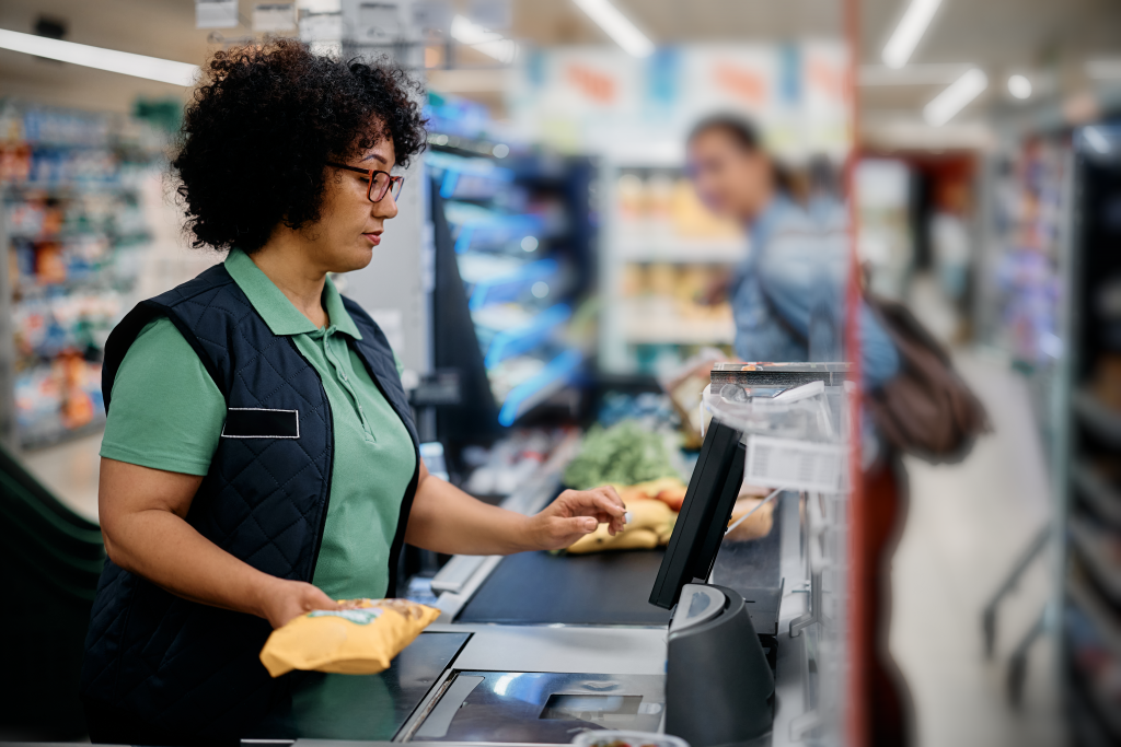 Cashier scanning items