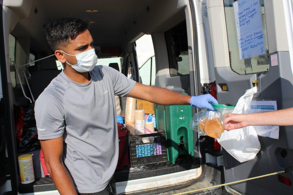 Volunteer giving food