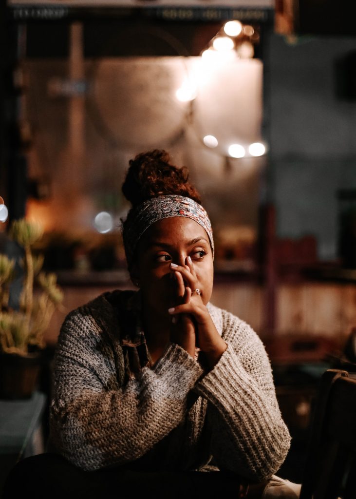 A woman sitting in deep reflection